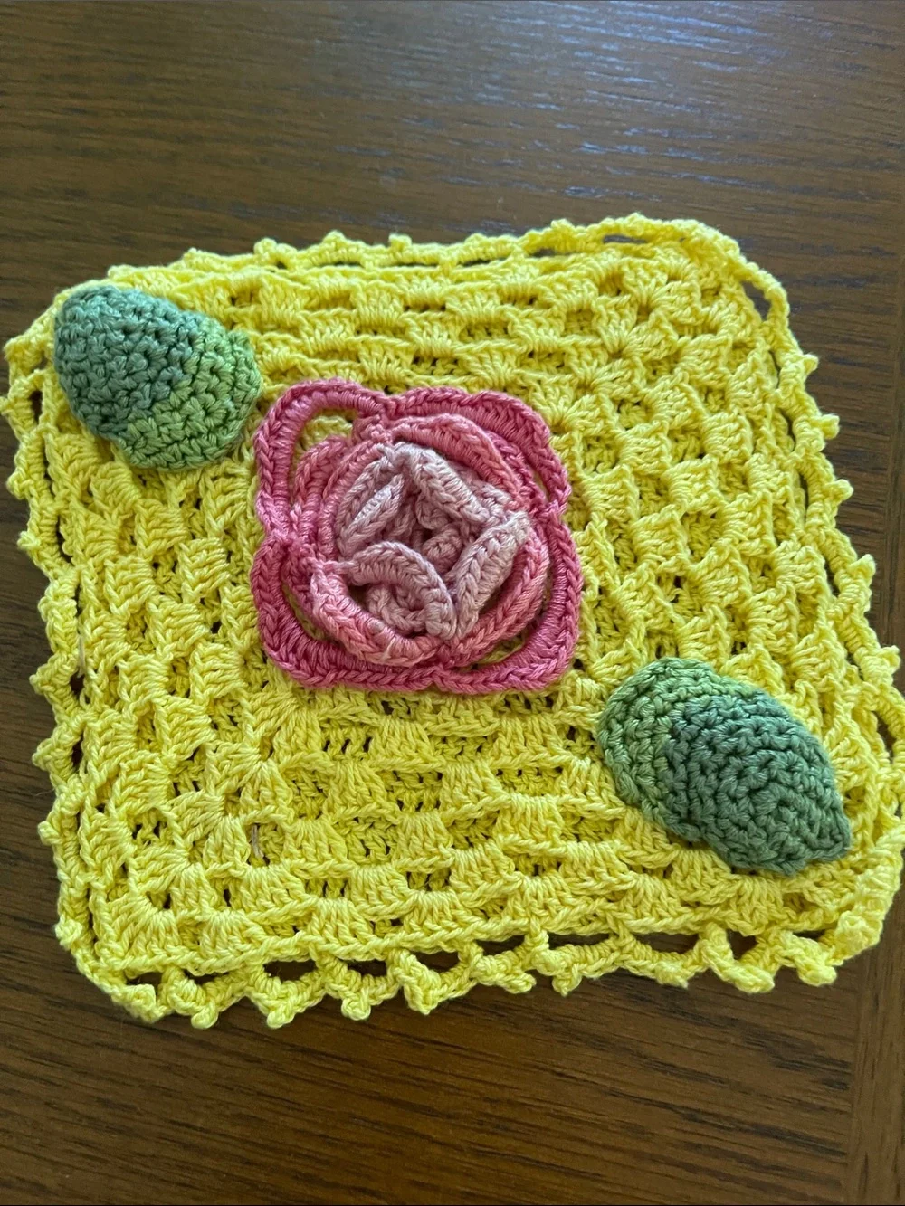 Hand Crafted Yellow Crochet Dishcloth with Pink Flower and Green Accents